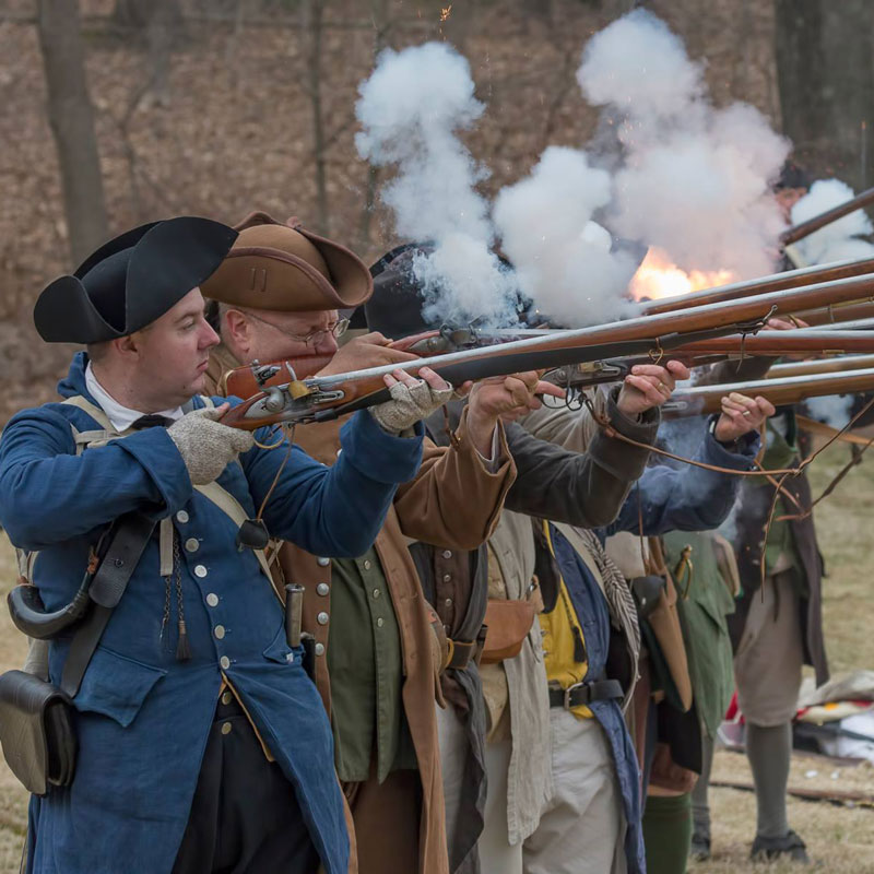 people firing muskets